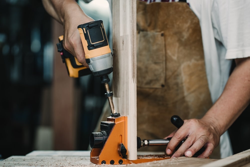 carpenter-use-drill-bit-centering-dowel